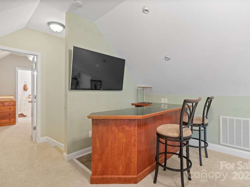524 Lawyers Road, Indian Trail, NC 28079.  MLS# CAR4285960, YatesRealty ID 35442. Upstairs Bonus Room with Bar