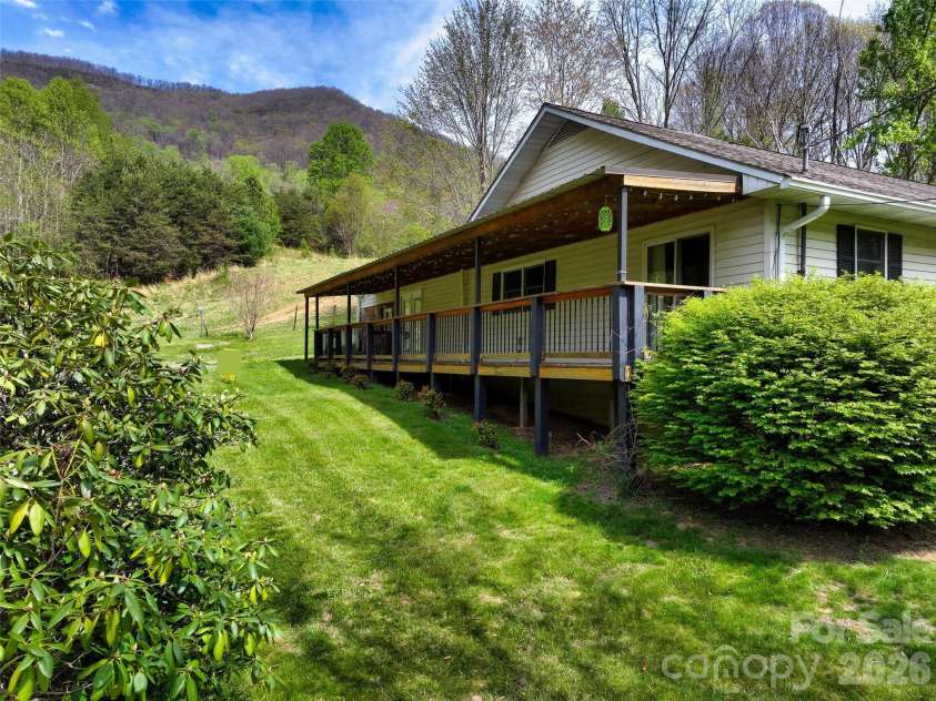 1567 Newfound Road, Leicester, NC 28748.  MLS# CAR4214973, YatesRealty ID 35448. Farmhouse in spring