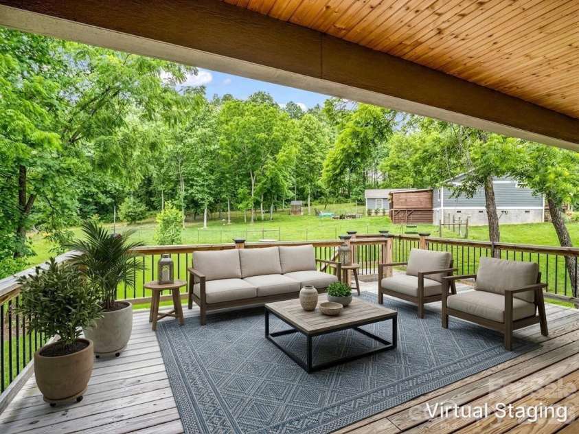 100 Walt Drive, Hendersonville, NC 28792.  MLS# CAR4391654, YatesRealty ID 35457. Back deck virtually staged