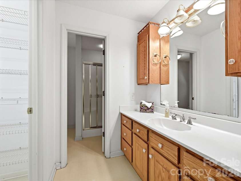 5950 King Wilkinson Road, Denver, NC 28037.  MLS# CAR4398523, YatesRealty ID 35480. Primary bath with excellent storage and walk-in closet
