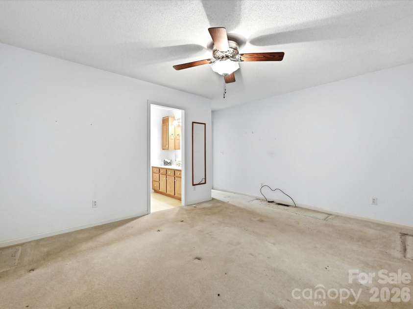 5950 King Wilkinson Road, Denver, NC 28037.  MLS# CAR4398523, YatesRealty ID 35480. Primary bedroom, ceiling fan