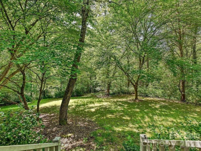 5950 King Wilkinson Road, Denver, NC 28037.  MLS# CAR4398523, YatesRealty ID 35480. Rear wooded area