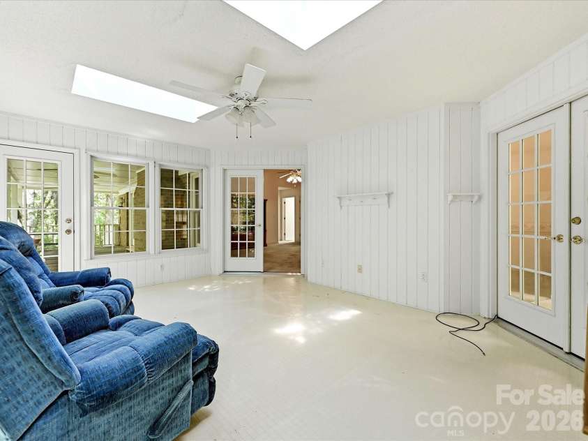 5950 King Wilkinson Road, Denver, NC 28037.  MLS# CAR4398523, YatesRealty ID 35480. Sunroom with skylights