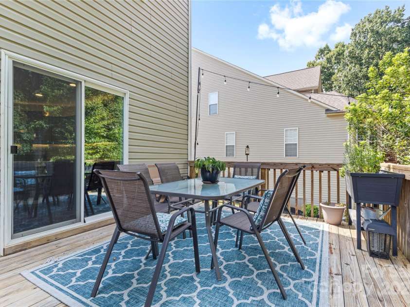 169 Pecan Hills Drive, Mooresville, NC 28115.  MLS# CAR4285952, YatesRealty ID 35482. Back deck with sliding glass doors off of kitchen