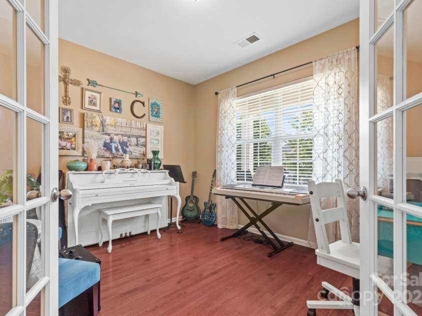 169 Pecan Hills Drive, Mooresville, NC 28115.  MLS# CAR4285952, YatesRealty ID 35482. French doors open to office/flex space on main that looks out to street