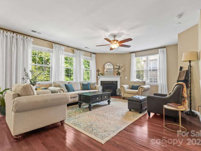 169 Pecan Hills Drive, Mooresville, NC 28115.  MLS# CAR4285952, YatesRealty ID 35482. Open living room with fireplace and lots of natural light