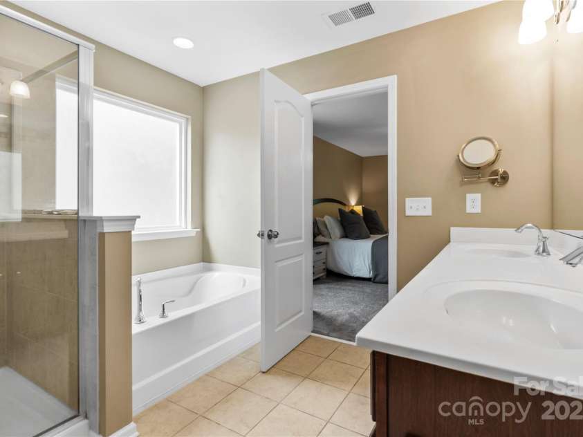 169 Pecan Hills Drive, Mooresville, NC 28115.  MLS# CAR4285952, YatesRealty ID 35482. Primary bath with separate shower and soaking tub