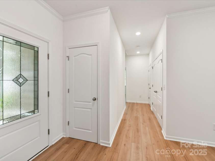 200 Sweet Briar Drive, Indian Land, SC 29707.  MLS# CAR4265722, YatesRealty ID 35484. The foyer opens to the grand living area and leads to two bedrooms and a hall bath.
