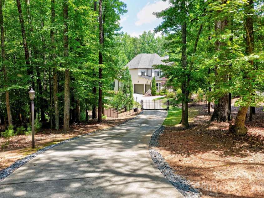 10530 Sweetleaf Place, Charlotte, NC 28278.  MLS# CAR4399864, YatesRealty ID 35490. Driveway approaching gate.