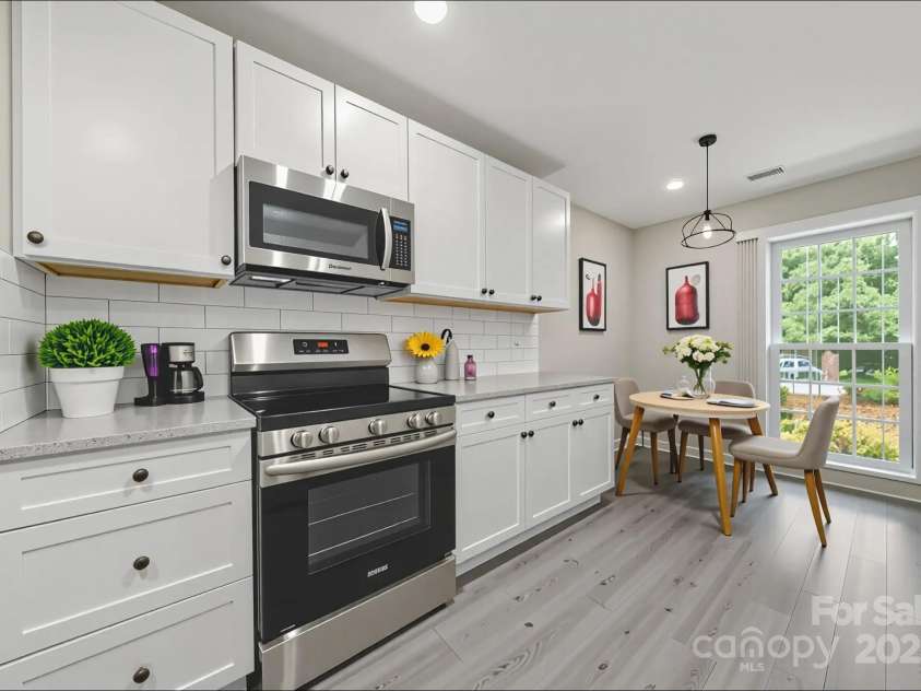 11120 Michaelangelo Court, Charlotte, NC 28226.  MLS# CAR4285230, YatesRealty ID 35495. Virtually staged kitchen to show room for table/chairs