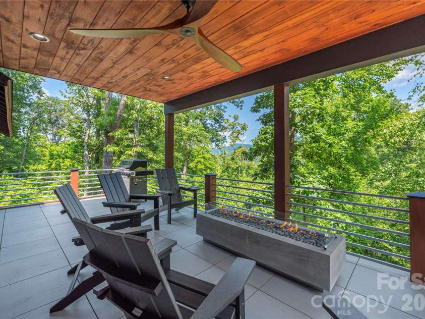 28 & 30 Garren View Drive, Fairview, NC 28730.  MLS# CAR4397889, YatesRealty ID 35499. Covered back deck with linear gas firepit