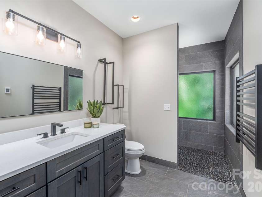 28 & 30 Garren View Drive, Fairview, NC 28730.  MLS# CAR4397889, YatesRealty ID 35499. Spa-like primary bathroom