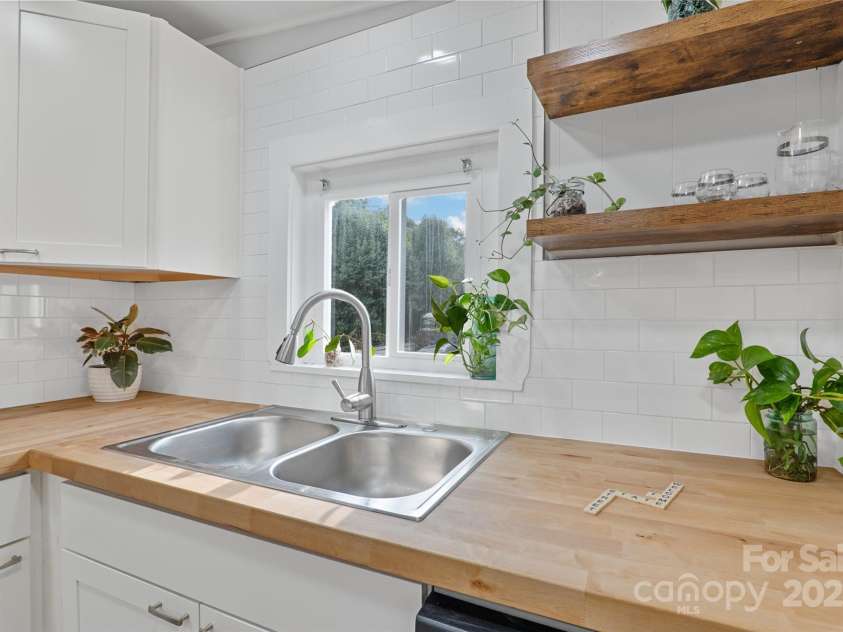 364 State Street, Asheville, NC 28806.  MLS# CAR4294913, YatesRealty ID 35499. Close up of refinished Butcher Block countertops and new floating shelves