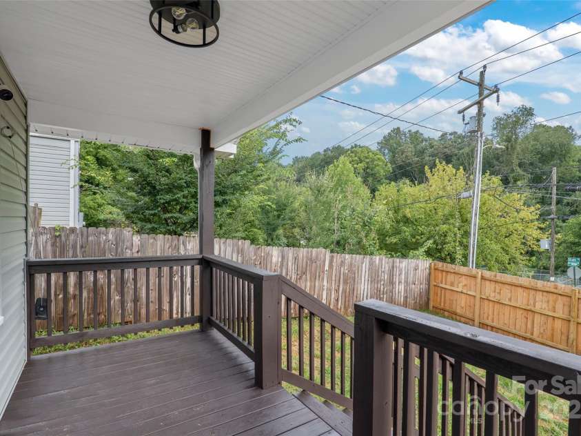 364 State Street, Asheville, NC 28806.  MLS# CAR4294913, YatesRealty ID 35499. Laundry room with utility sink, floating shelves and new luxury vinyl plank floors
