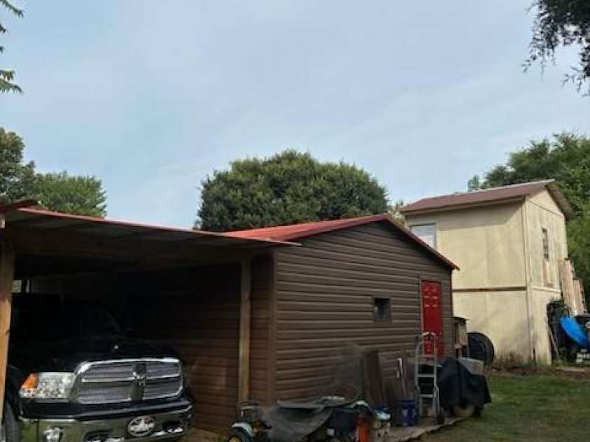 529 Cedar Street, Troutman, NC 28166.  MLS# CAR4397569, YatesRealty ID 35501. Outbuilding with lean-to.
