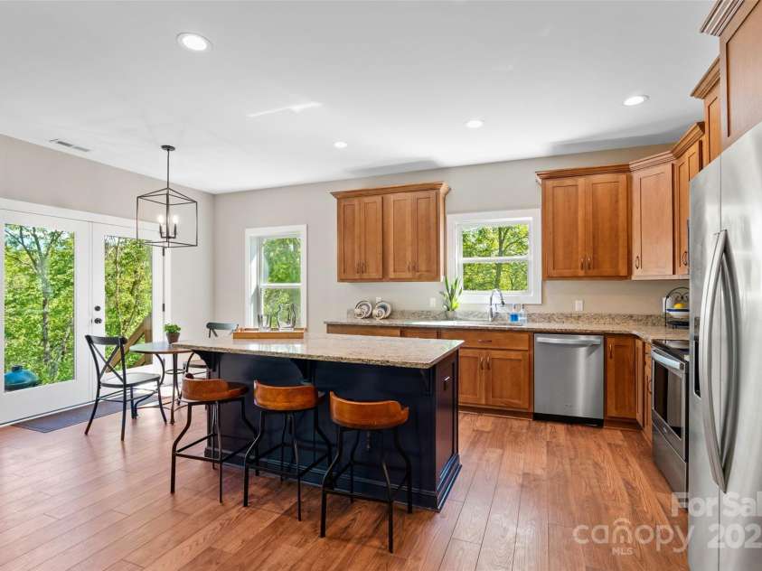 221 Starry Night Lane, Marshall, NC 28753.  MLS# CAR4297085, YatesRealty ID 35517. Fully equipped kitchen with Hickory cabinets/Granite countertops and stainless appliance package