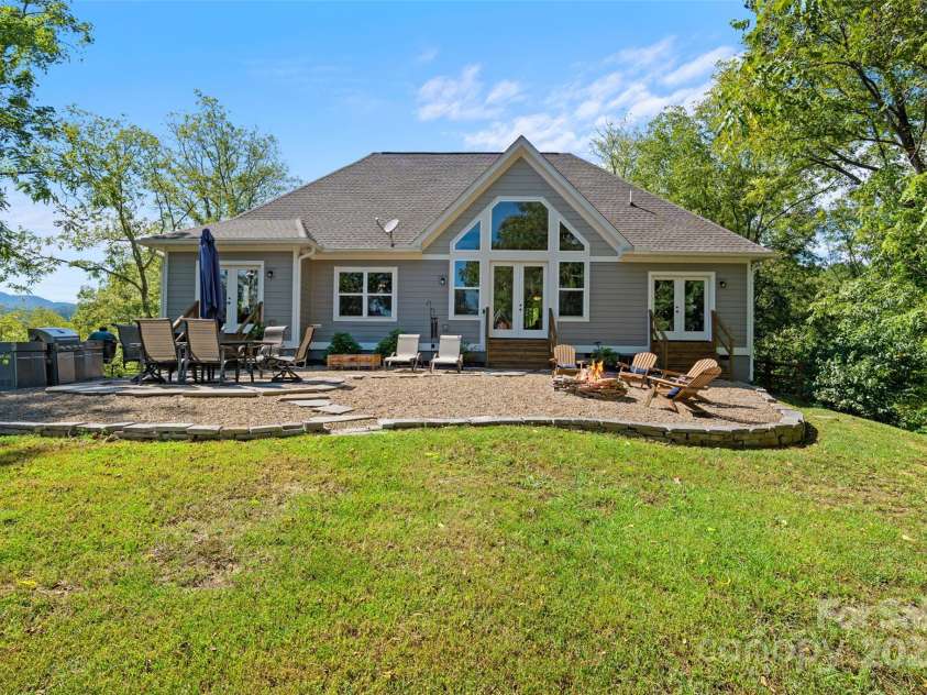 221 Starry Night Lane, Marshall, NC 28753.  MLS# CAR4297085, YatesRealty ID 35517. Level backyard area to enjoy sounds of the French Broad River below and mountain views