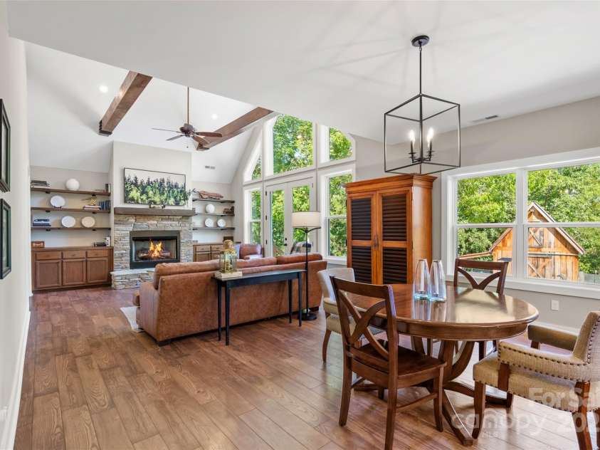 221 Starry Night Lane, Marshall, NC 28753.  MLS# CAR4297085, YatesRealty ID 35517. View from open dining room to open living room, plenty of natural light