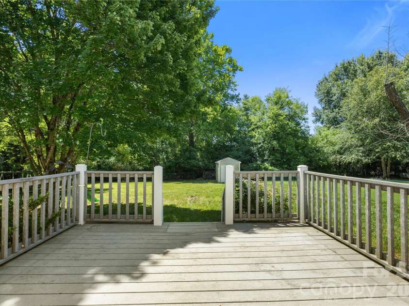 3571 Farm Lake Drive, Concord, NC 28027.  MLS# CAR4397456, YatesRealty ID 35526. Back deck featuring TREX decking