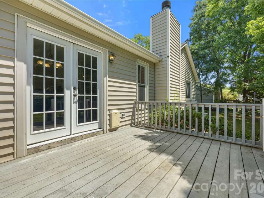 3571 Farm Lake Drive, Concord, NC 28027.  MLS# CAR4397456, YatesRealty ID 35526. Back deck showcasing the french doors