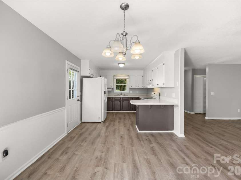 3571 Farm Lake Drive, Concord, NC 28027.  MLS# CAR4397456, YatesRealty ID 35526. View from the dining area looking into the kitchen