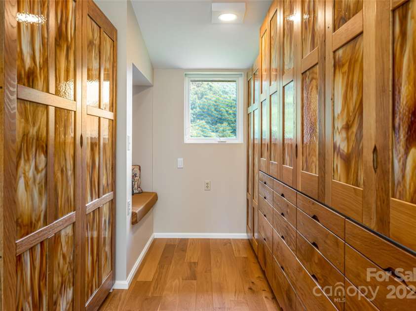 315 Earlys Mountain Road, Leicester, NC 28748.  MLS# CAR4295001, YatesRealty ID 35531. Primary walk-in custom closet. Stained glass doors all custom made.