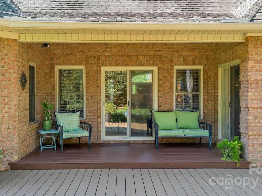101 Cabana Drive, Mooresville, NC 28117.  MLS# CAR4293731, YatesRealty ID 35535. Bring your book or just sit and enjoy privacy in your backyard under your covered deck.