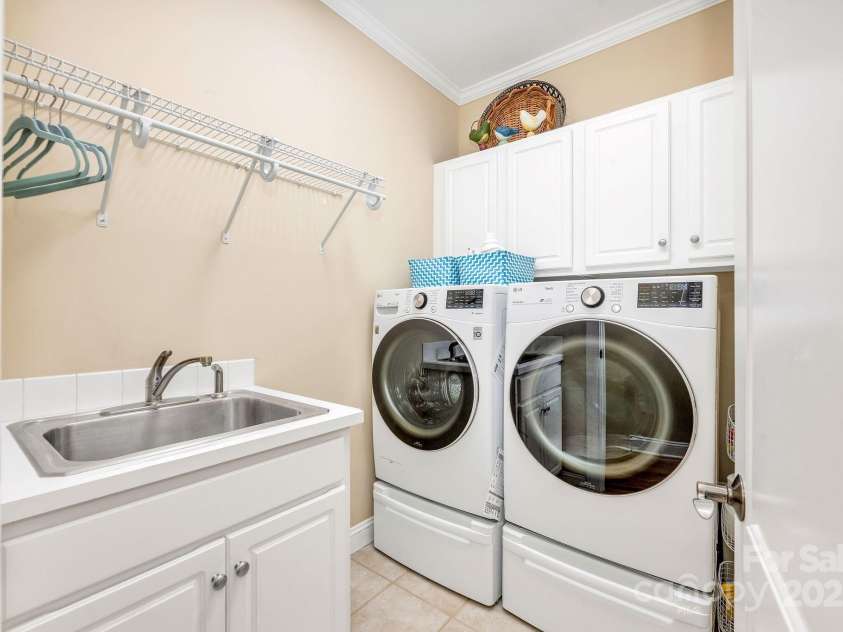 101 Cabana Drive, Mooresville, NC 28117.  MLS# CAR4293731, YatesRealty ID 35535. Laundry / mud room coming off of the garage with sink and cabinets