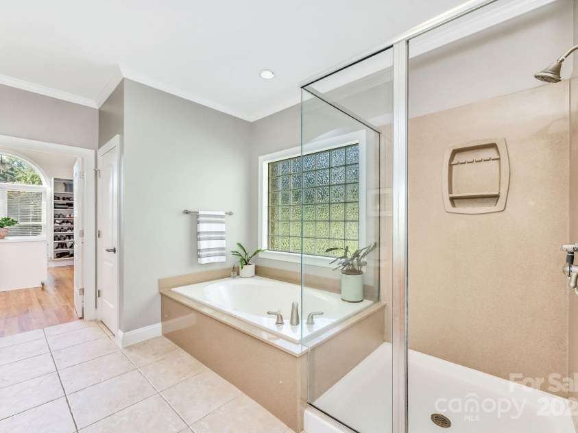 101 Cabana Drive, Mooresville, NC 28117.  MLS# CAR4293731, YatesRealty ID 35535. Soaking tub and walk in shower