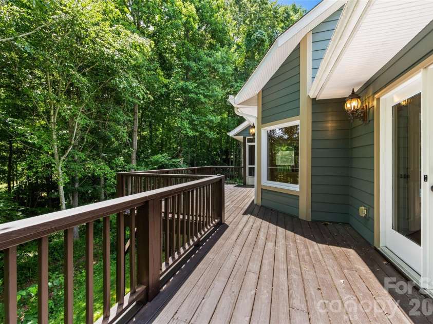 435 Stepping Stone Lane, Waynesville, NC 28786.  MLS# CAR4399751, YatesRealty ID 35549. From main level primary to deck.