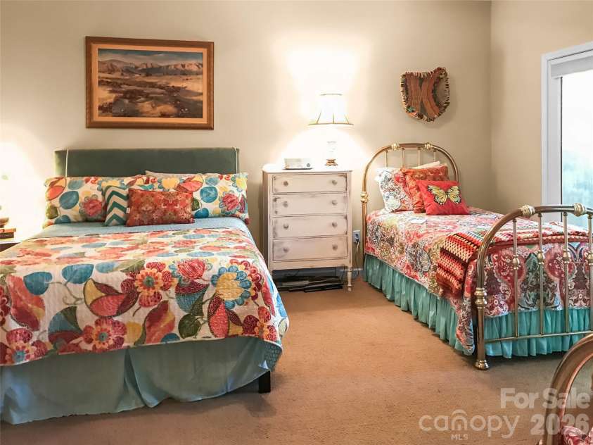 435 Stepping Stone Lane, Waynesville, NC 28786.  MLS# CAR4399751, YatesRealty ID 35549. Lower level primary bedroom 1 view 2
