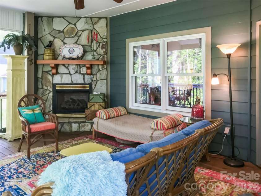 435 Stepping Stone Lane, Waynesville, NC 28786.  MLS# CAR4399751, YatesRealty ID 35549. Main level deck towrd greatroom windows