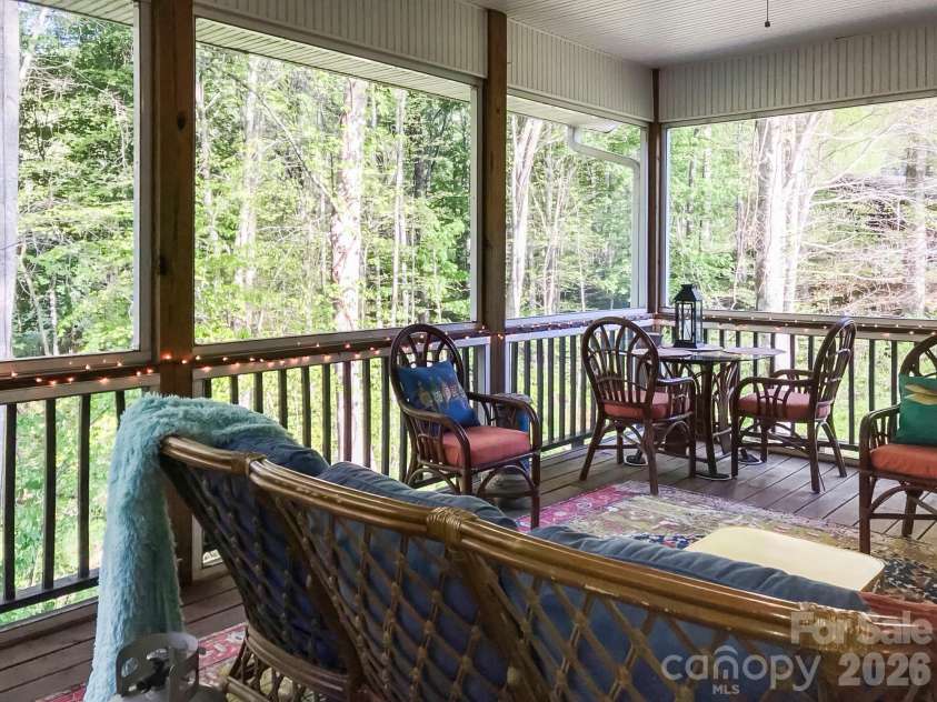 435 Stepping Stone Lane, Waynesville, NC 28786.  MLS# CAR4399751, YatesRealty ID 35549. Virtual Main level screened deck view 2