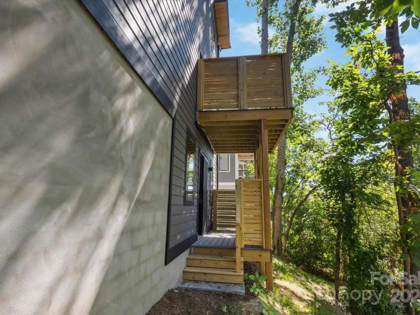 207 Torch Light Way, Asheville, NC 28806.  MLS# CAR4159369, YatesRealty ID 3555. Basement Covered Deck