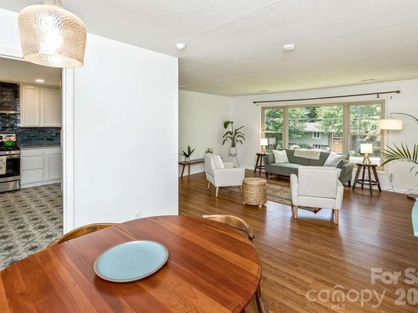 17 Rhododendron Place, Asheville, NC 28805.  MLS# CAR4399647, YatesRealty ID 35559. Open floor plan - dining to living room