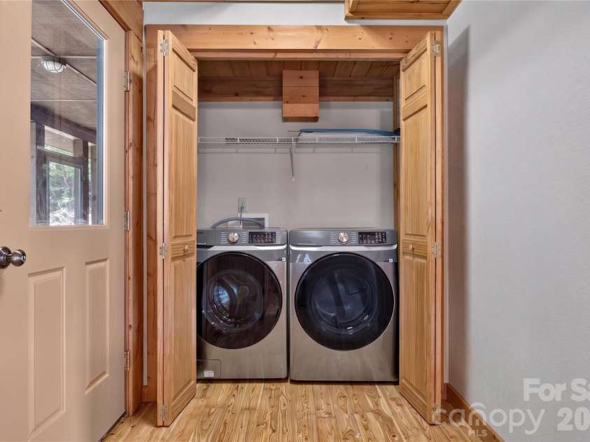 335 Whites Lake Boulevard, Saluda, NC 28773.  MLS# CAR4390961, YatesRealty ID 35568. Laundry off the kitchen.