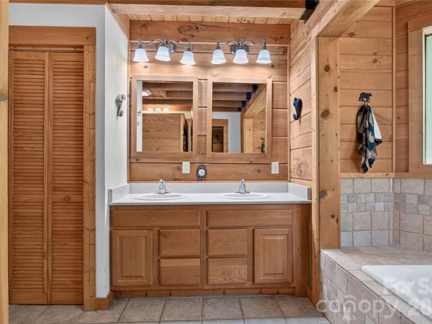335 Whites Lake Boulevard, Saluda, NC 28773.  MLS# CAR4390961, YatesRealty ID 35568. Primary bathroom.