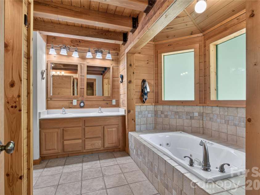335 Whites Lake Boulevard, Saluda, NC 28773.  MLS# CAR4390961, YatesRealty ID 35568. Primary bathroom.