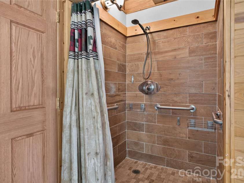 335 Whites Lake Boulevard, Saluda, NC 28773.  MLS# CAR4390961, YatesRealty ID 35568. Primary shower.