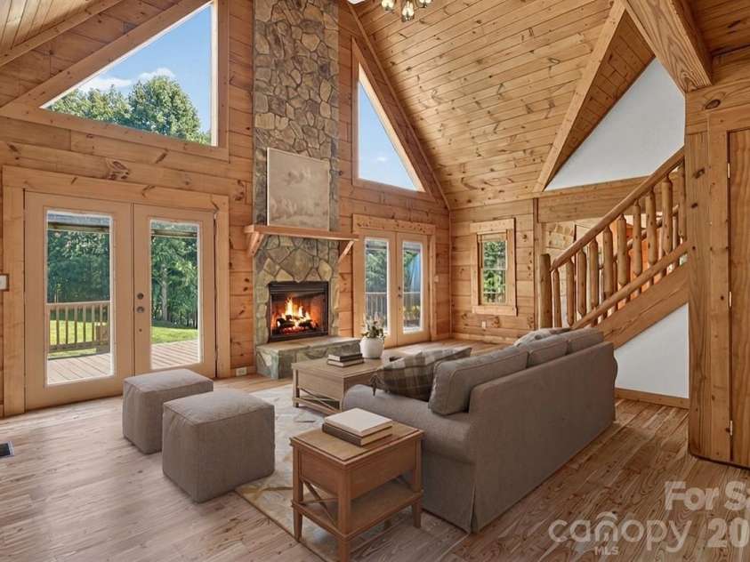 335 Whites Lake Boulevard, Saluda, NC 28773.  MLS# CAR4390961, YatesRealty ID 35568. Virtually staged living room.