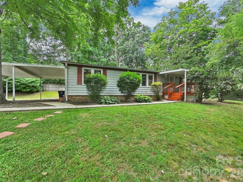 10 Canyon Cove, Candler, NC 28715.  MLS# CAR4400495, YatesRealty ID 35575. Lovely Covered Front Porch and Sidewalk