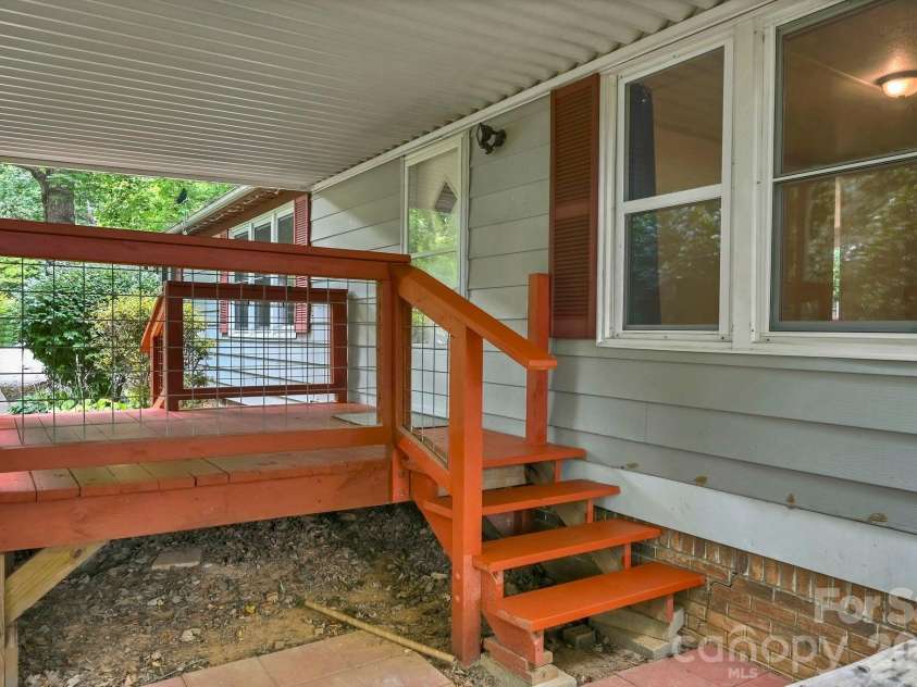 10 Canyon Cove, Candler, NC 28715.  MLS# CAR4400495, YatesRealty ID 35575. Two Entrances to Covered Front Porch