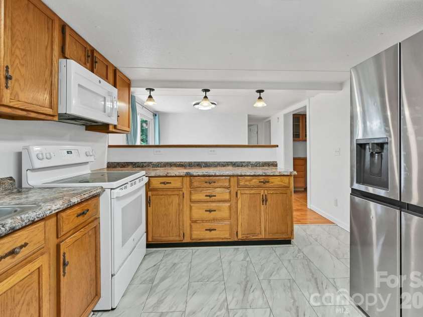 10 Canyon Cove, Candler, NC 28715.  MLS# CAR4400495, YatesRealty ID 35575. View From Kitchen Towards Breakfast Bar