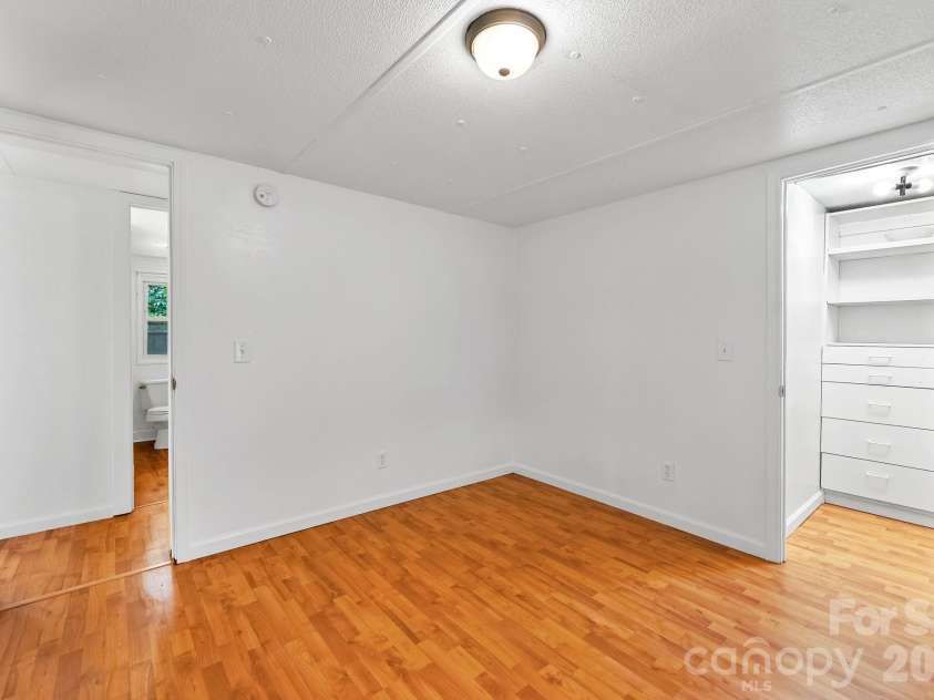 10 Canyon Cove, Candler, NC 28715.  MLS# CAR4400495, YatesRealty ID 35575. View of Walk In Third Bedroom