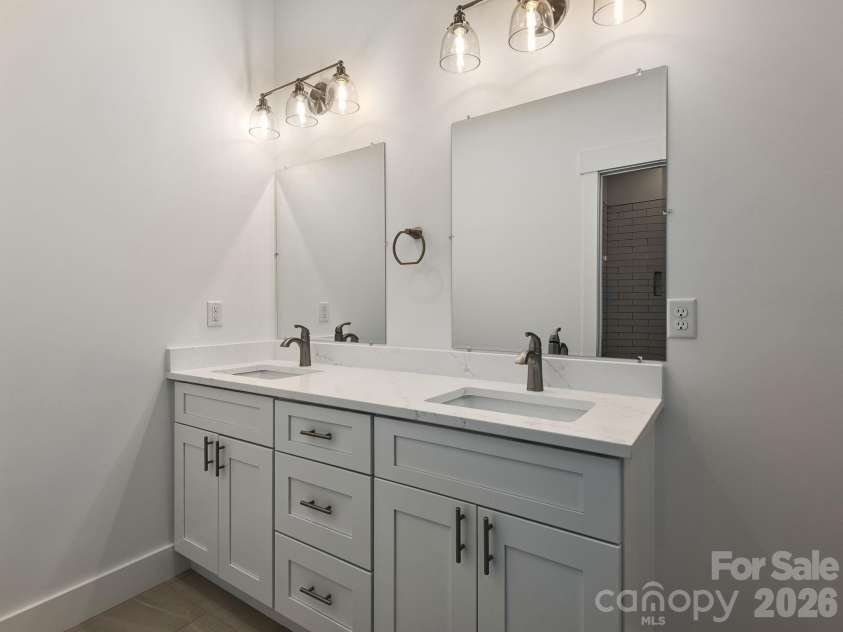 105 Sheila Wynne Drive, Hendersonville, NC 28732.  MLS# CAR4394668, YatesRealty ID 35580. Lower level full bathroom