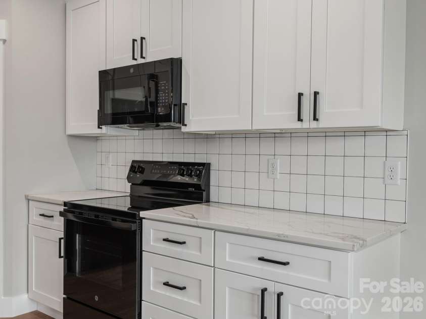 105 Sheila Wynne Drive, Hendersonville, NC 28732.  MLS# CAR4394668, YatesRealty ID 35580. Main level kitchen