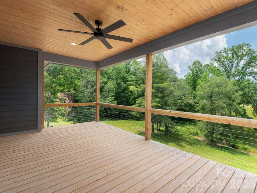 105 Sheila Wynne Drive, Hendersonville, NC 28732.  MLS# CAR4394668, YatesRealty ID 35580. Main level rear porch