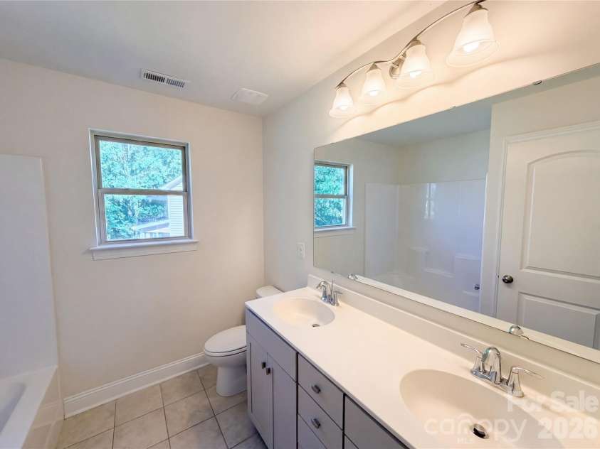 1908 Cantrell Court, Matthews, NC 28104.  MLS# CAR4401557, YatesRealty ID 35619. Primary bathroom with water closet
