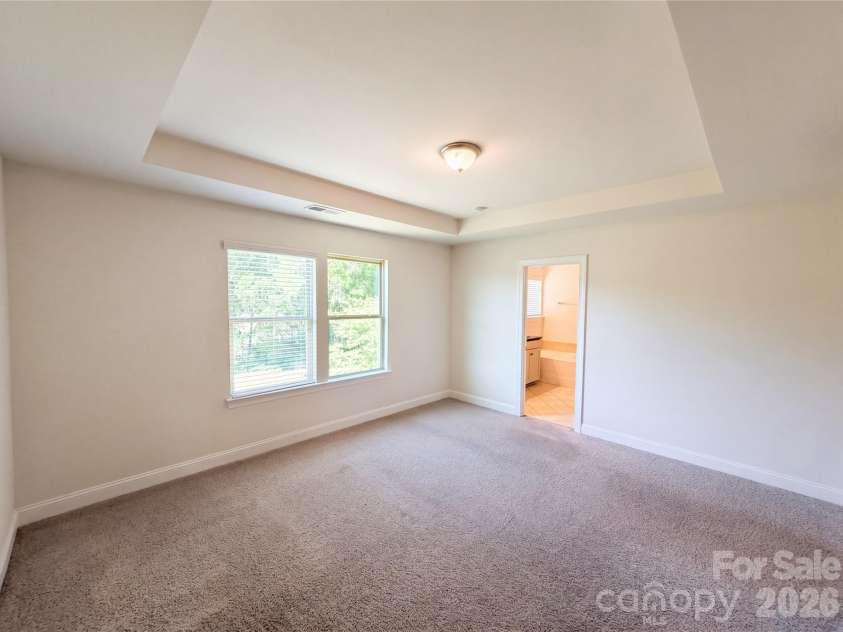 1908 Cantrell Court, Matthews, NC 28104.  MLS# CAR4401557, YatesRealty ID 35619. Primary bedroom