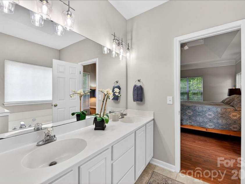 1423 Piper Court, Concord, NC 28025.  MLS# CAR4376412, YatesRealty ID 35626. Primary ensuite with updated lighting